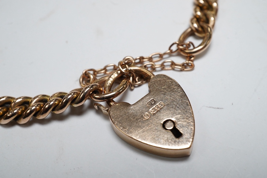 A 9ct god curb link bracelet, with heart shaped padlock clasp, 18cm, 13.8 grams. Condition - fair to good